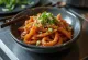 Ojingeochae Muchim, koreansk blekksprutsalat, med sesamolje og chilipulver
