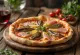 Pizza Capricciosa med ansjos servert