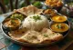 Thali i Maharashtra-stil med fersk koriander og chiliskiver